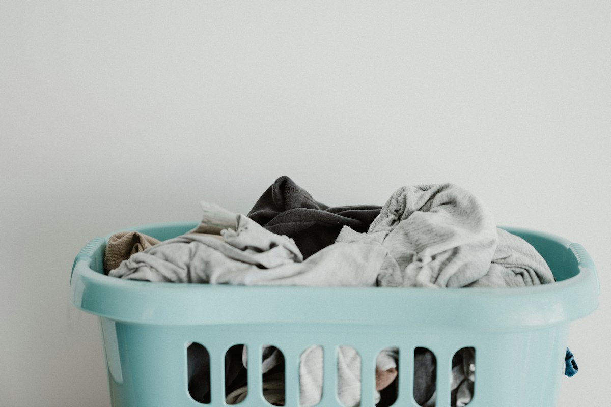 Folded towels stacked on a bathroom shelf